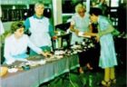 Old photo of volunteers selling items on a stall
