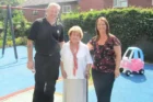 A photograph of Patricia Daniels and 2 other people in the children's play area