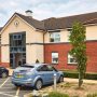 A photograph of the front of the care home building