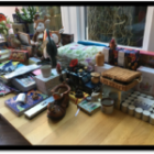 The image shows a variety of gift items for the shop. Items such as cuddly toys, toiletries and candles are shown