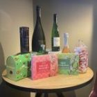 The photo shows a selection of wines and beers